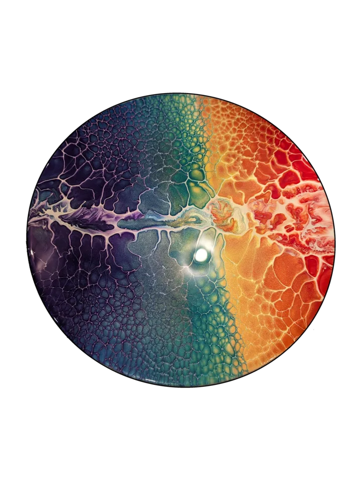 Round bloom painting with a bright central line separating violet and teal from orange and yellow cells.