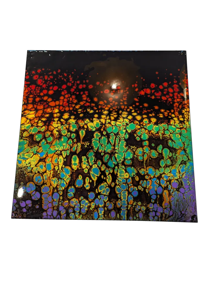 Square rainbow cellular pour with red, orange, green, turquoise and violet over black.