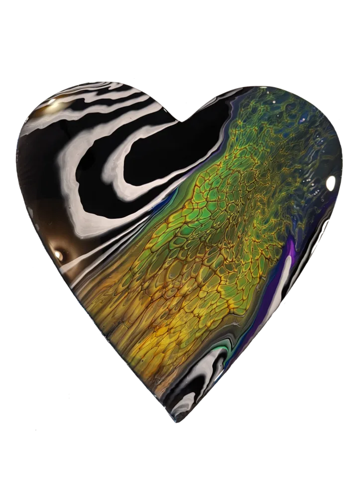 Heart-shaped pour combining black and white stripes with green, gold, blue and violet cells.