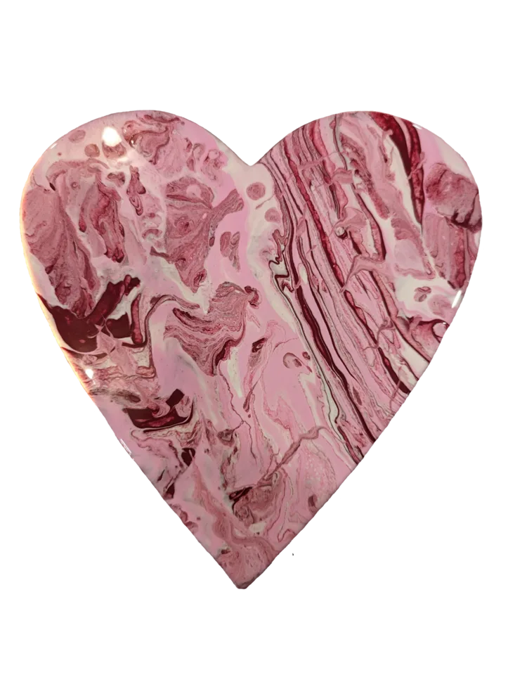 Heart-shaped pour in layered blush, rose, burgundy and white marble patterns.