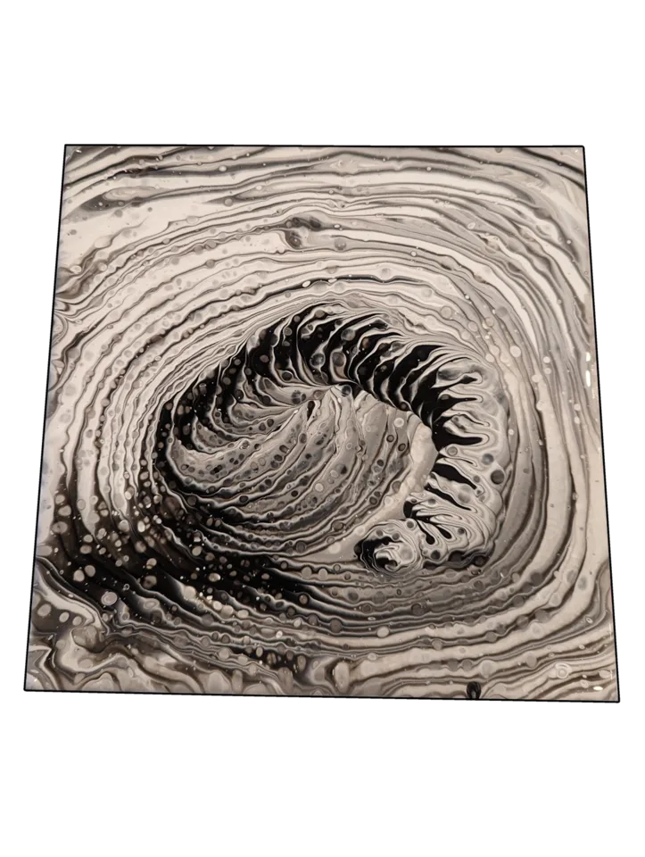Square black, white and gray pour forming a layered spiral wave.
