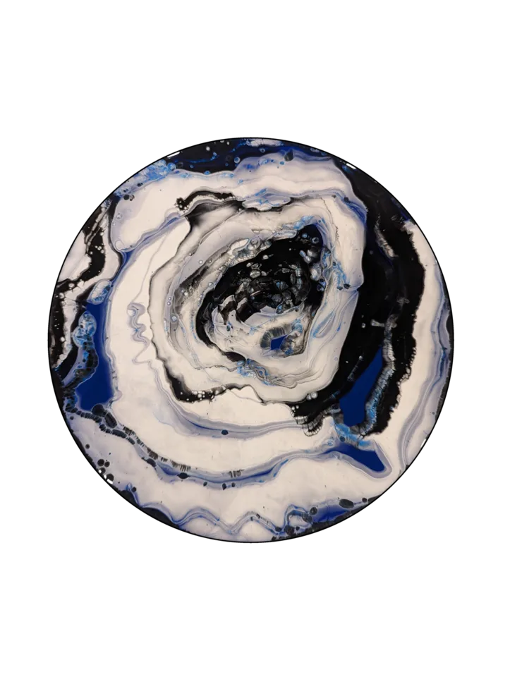 Round painting with black, white and cobalt blue rings forming a dramatic stone-like center.