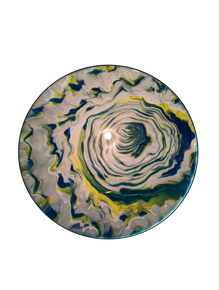 Round layered pour in white, navy, green and yellow forming a broad spiral.